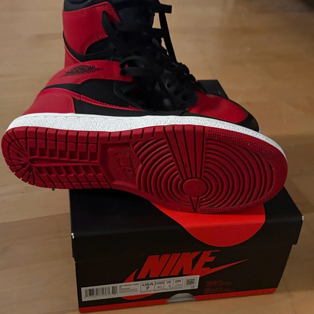 Nike Air Jordan 1 High in Black and Red